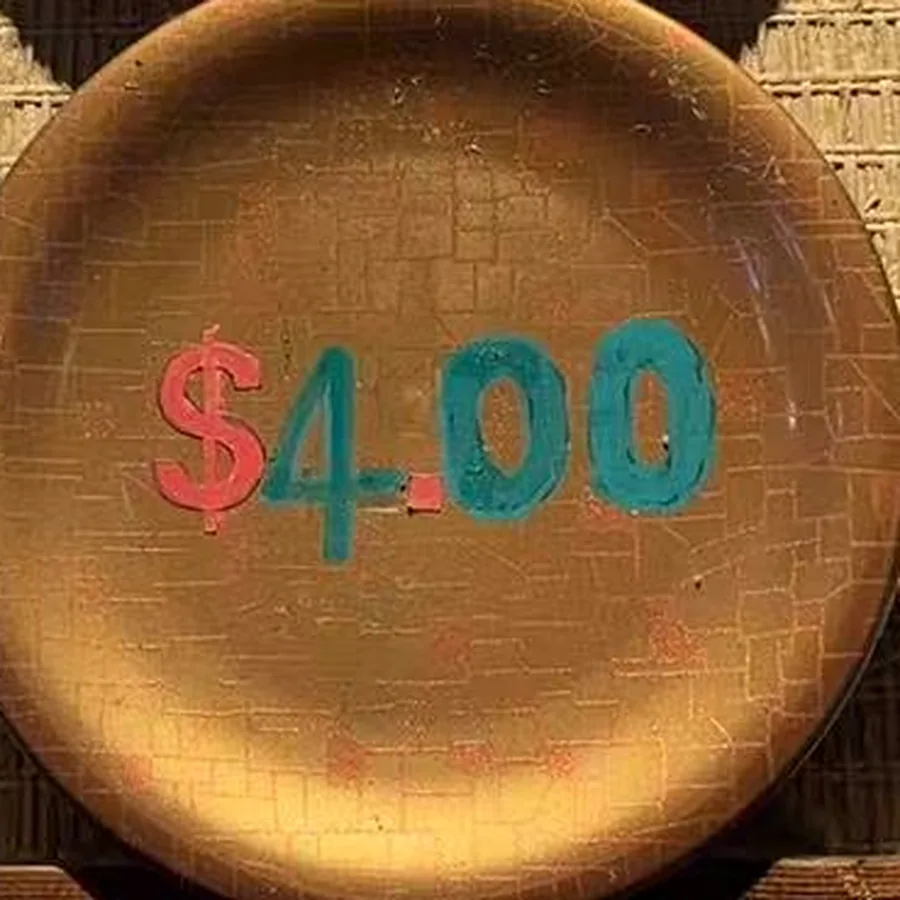 The gold plate — burnished gold leaf with $4.00 painted across it